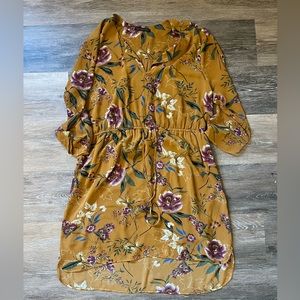 Yellow floral dress, lightweight and lined with a cinch at the waist